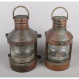 A Pair of Copper Ships Lamps, produced by Hop Lee & Co (Hong Kong) with Oil Burner. Lamps for
