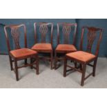 A set of four mahogany Chippendale style dining chairs.