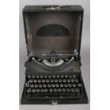A cased Imperial Good companion typewriter.