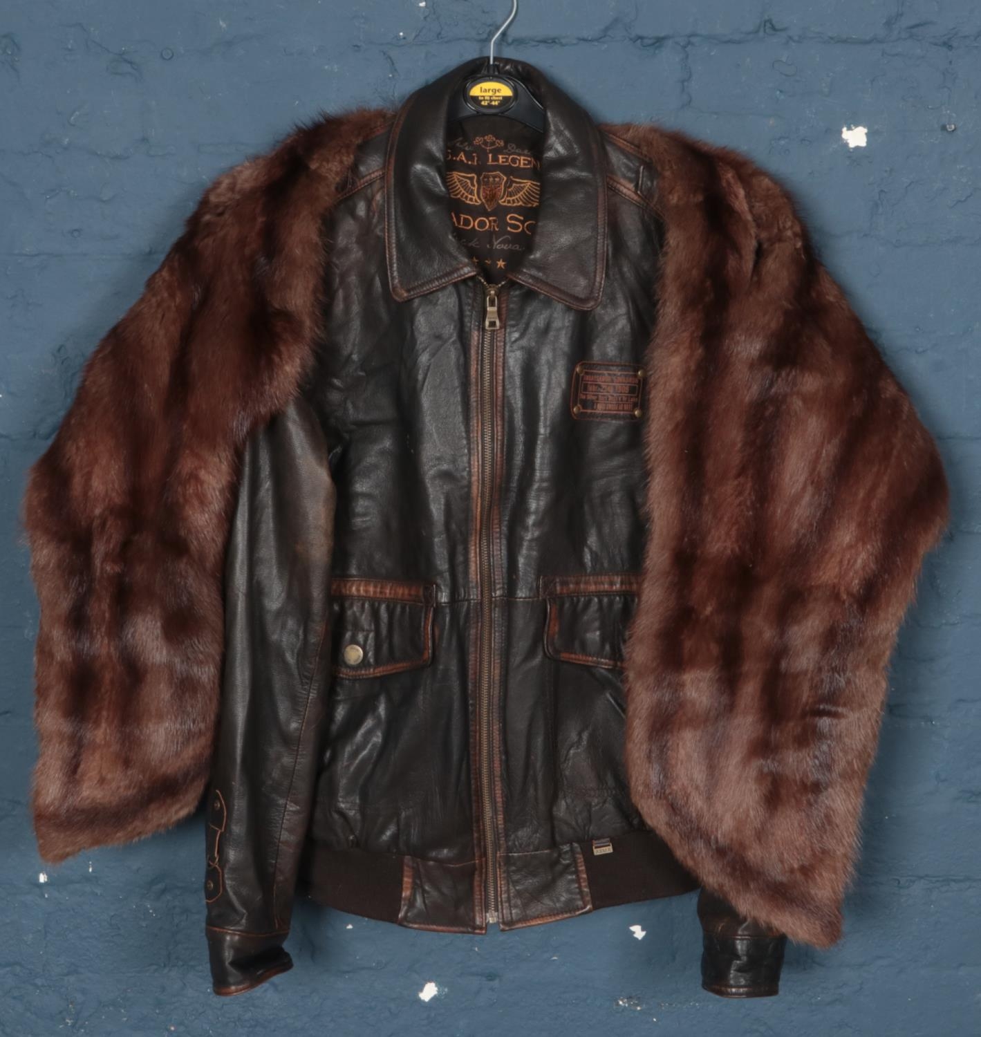 A Silver Dart R.C.A.F. Legends Ambassador Squadron leather jacket along with a fur stole.