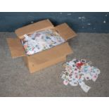 A box containing over 7kg of used kilo ware stamps. Mostly security stamps, some unfranked.