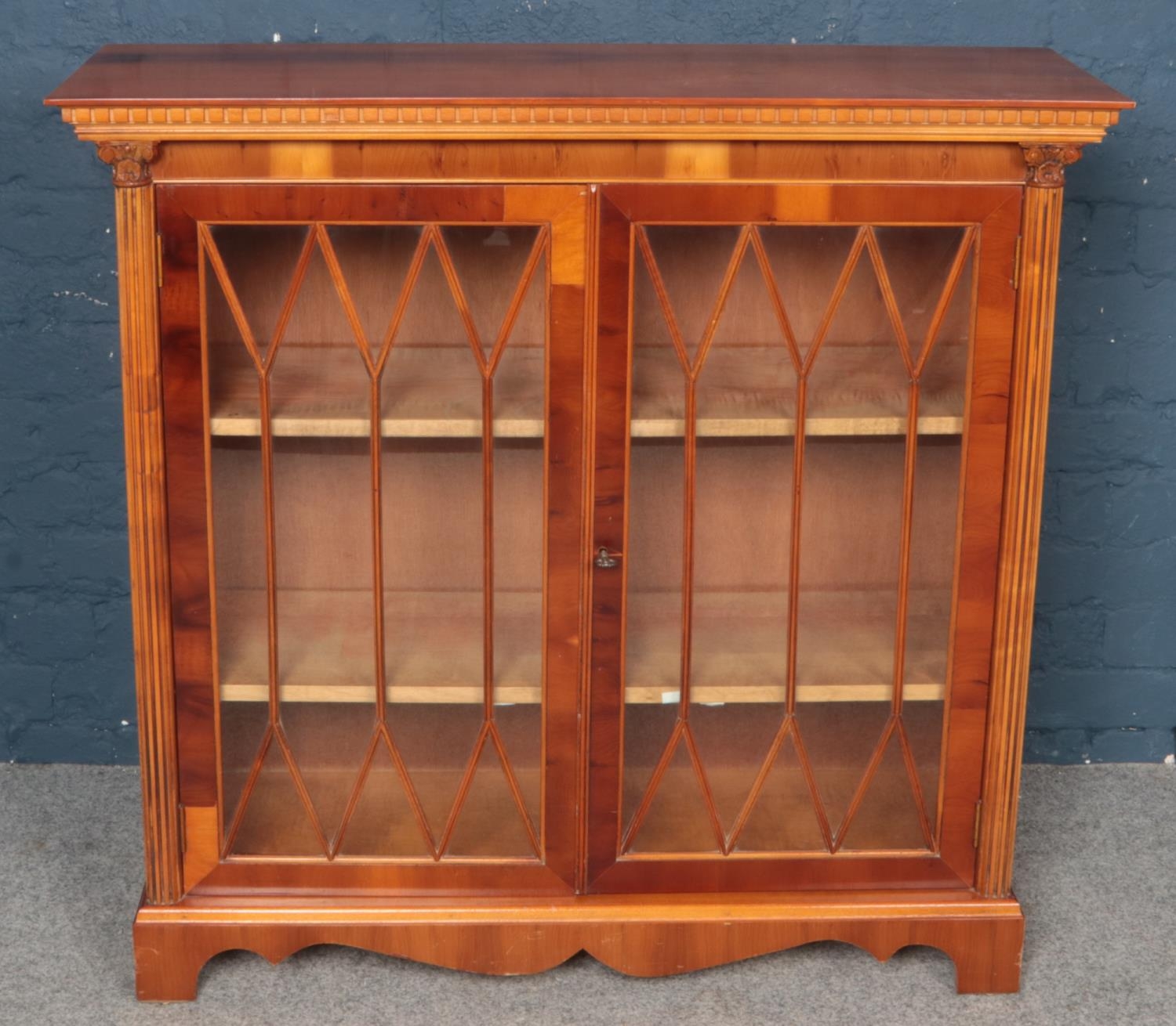 A Yew-Wood Glazed Two Door Bookcase.