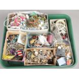 A large tray of costume jewellery. Including necklaces, bangles, bracelets, rings, brooches, etc.