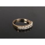 A 9ct gold seven stone paste set ring. size M.