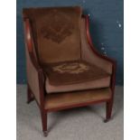 A Mahogany Winged Easy Chair with Fabric Seat and Back.