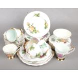 A Harry Wheatcroft 'Paragon' Part Tea Service. Includes Teacups and Saucers, Side Plates and Sugar