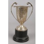 A miniature silver cup on stand, replica of The Sheffield Daily Telegraph Challenge Cup. Awarded