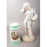 A continental pottery figure of a boy along with a pottery stein with lithophane panel to base.