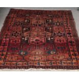 An Aztec multiple design rug. L:206cm W: 152cm.