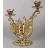 A Brass Religious Candlestick with Hinged Opening revealing the Star of David at the Top of Each