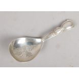 A Victorian silver caddy spoon. Assayed Birmingham 1882 by Hillard & Thompson.