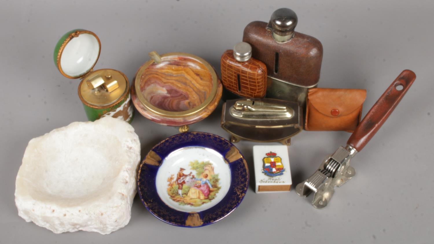 A Collection of Smoking and Drinking Items. To include: Two Hip Flasks, Cigarette Lighters and Ash