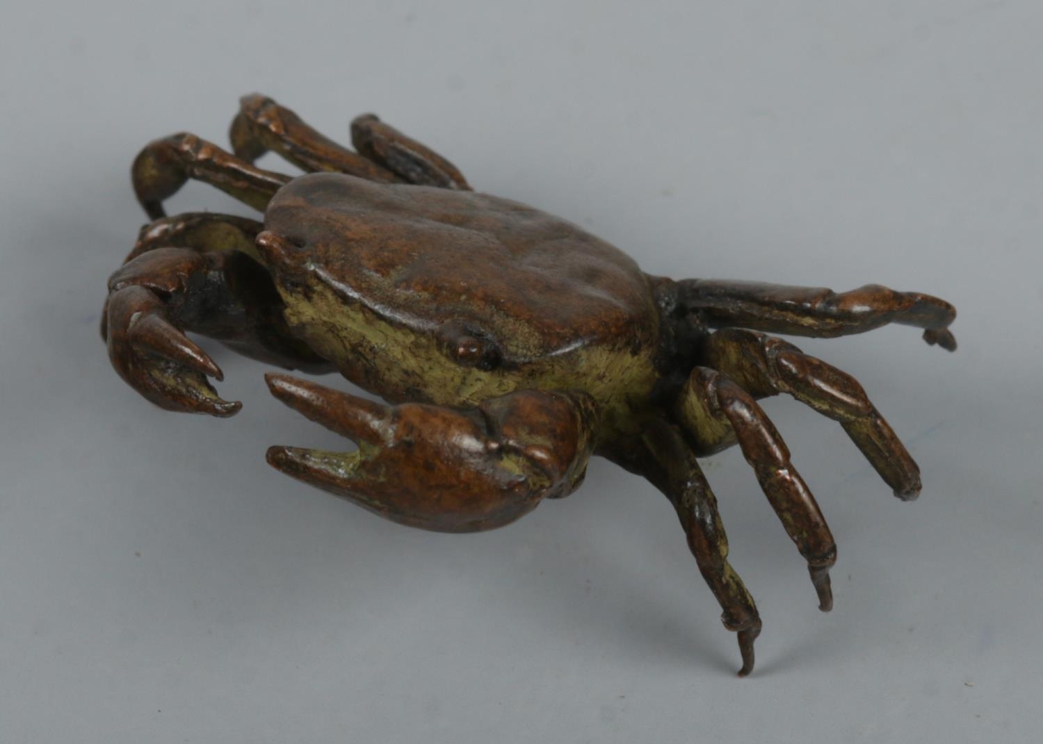 A small bronze figure of a crab.