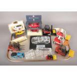 A quantity of boxed and loose die-cast scale models. To include seven Linde Lansing forklift trucks,