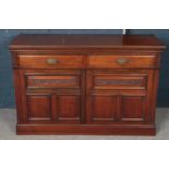 A carved and panelled mahogany sideboard. (90cm x 136cm) Previously a mirror back.