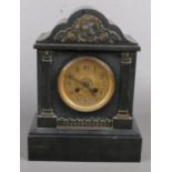 A Black Slate Marble Clock with Gold Cartouche Decoration to the Top. Crack in the Glass on the