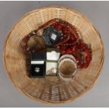 A Basket Containing Costume Jewellery. Includes Dress Rings, Bangles and Necklaces.