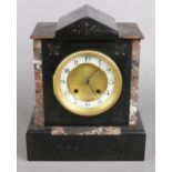 A Black Slate and Marble Mantel Clock with 'The Britannia Movement'. Height 27cm. Condition Fair,