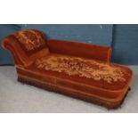 An Victorian upholstered chaise longue.