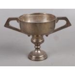 An Art Deco Silver Twin Handled Cup. Assayed for Sheffield, 1931 by Viners Ltd. Total Weight 197g.