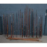 A quantity of vintage fishing rods.