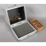 An Aluminium case with contents of coins. Including UK pre decimal and other world coins, etc.