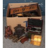A Box of Miscellaneous. To include Two Brass Desk Cannons, A Compass Set, A Group of Cigarette Cards