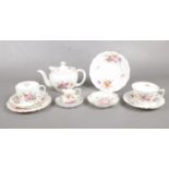 A part Crown Derby tea set. To include small teapot, two cups & saucers, plate and trinket dish etc.