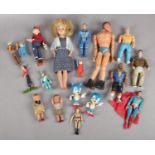 A collection of toy action figures and dolls. Including Cannell Mr T, Action Man, Metal Superman,
