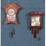 Two wall clocks. Including modern cuckoo clock depicting eagles, etc.