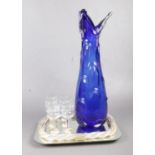 A large cobalt blue Murano style splash vase together with a mirrored tray and six port glasses.