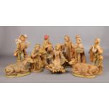A ten piece composite Christmas nativity scene. Comprising of figures and animals. Tallest figure
