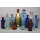 A collection of vintage glass bottles. Wm Stones Ltd Canon Brewery Sheffield, Boots Cash Chemist,