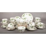 A Colclough tea set. cups/saucers, milk jug, sugar bowl, plates, cake stand.