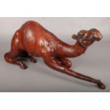 A large leather kneeling camel. (26cm x 57cm)