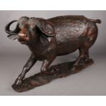 An extremely large hardwood carving of a horned water buffalo. Length: 80cm. Repairs to Horns.
