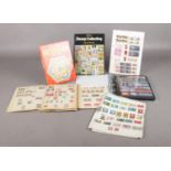 A large collection of stamps from the UK and around the world. To include an album with stamp sets