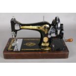 A Cased Singer Sewing Machine.