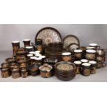 A large quantity of Denby Arabesque tea & dinner wares. tea cups/saucers, coffee cups, coffee pot,