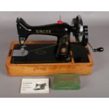 A Singer '99k' Sewing Machine, with Original Instructions and Accessory Box.