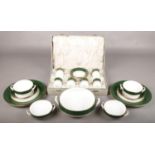A collection of Spode Green Velvet porcelain dinnerwares. Includes cased cups and saucers.