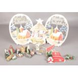 An eleven piece ceramic Christmas nativity scene along with four vintage card Christmas decorations.