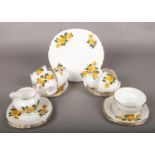 A Royal Vale Yellow Rose Part Tea Service. Includes Cups, Saucers and Side Plates Restoration to one