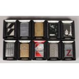 Ten Zippo Lighters, with Décor relating to the Zippo Company.