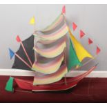 A kite formed as a sail boat. (100cm height 107cm width)