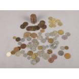 A small collection of UK and the world coins and tokens. To include Victorian Pennies from 1896,