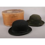 A Boxed Dunn & Co bowler hat & one similar example. Long Oval. 20cm x 15cm.