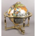 A modern gemstone globe on stand. With inset compass to base.