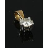 A diamond pendant with 18ct gold link. 1.00g. Approximately 0.5 carat diamond.