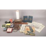 A box of collectables. To include a magnifying glass in leather pouch, a wooden truncheon, six